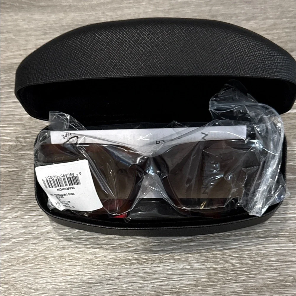 Salvatore Ferragamo Tortoise Sunglasses with SF Logo at Temples.